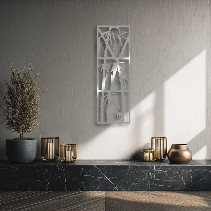 The elegant brushed silver finish of the minimalist bamboo metal wall decor adds a serene touch to the room.