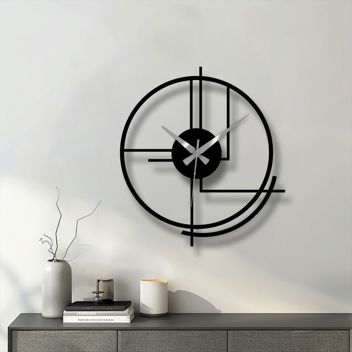 Against the plain background, a modern circular metal wall clock's abstract lines offer an eye-catching decoration wall art piece for any room.