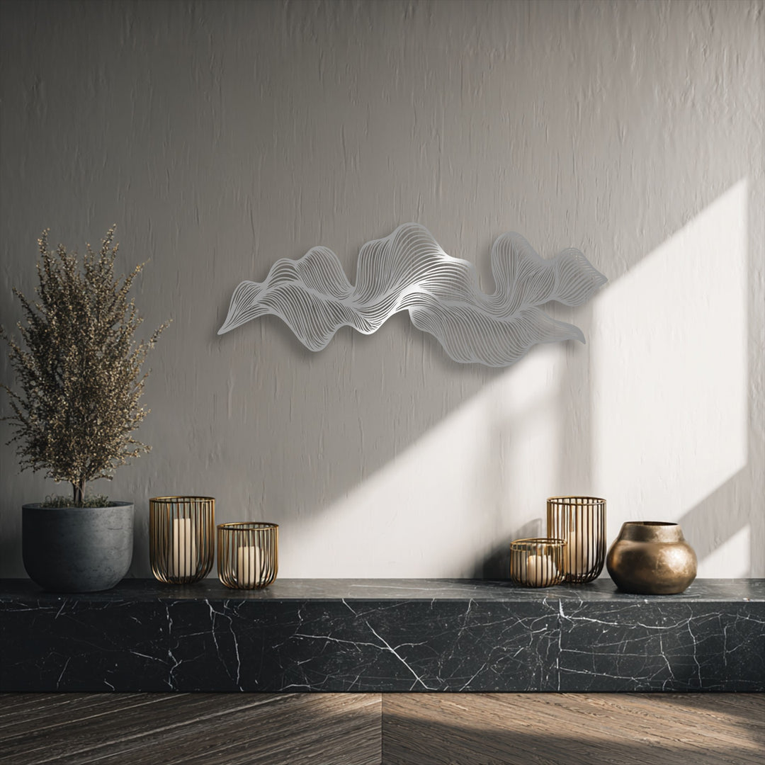 The textured light gray background wall provides a subtle yet elegant setting for the abstract wave flow metal decoration wall art.