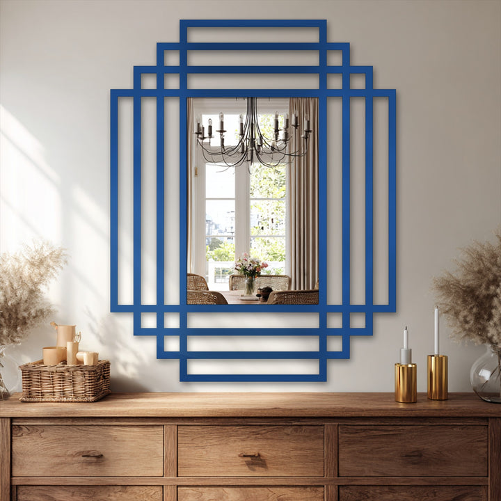 Brightest within the mirrored reflection reveals a dining room setting, framed by a striking symmetry grid decorative mirror featuring a modern, layered design in a bold, blue hue.
