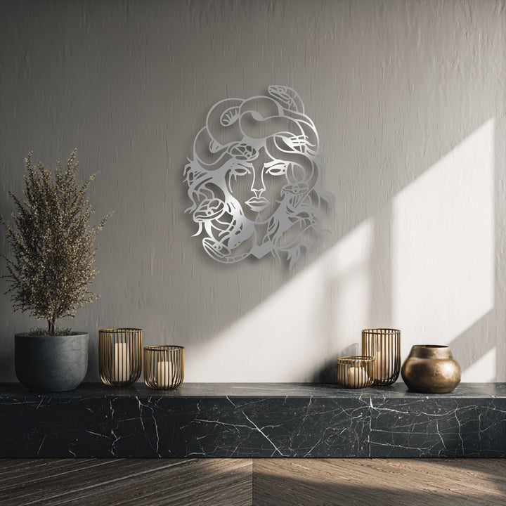 The central subject is an intricate, silver-toned Medusa metal decoration wall art, featuring the mythological goddess with snakes for hair.