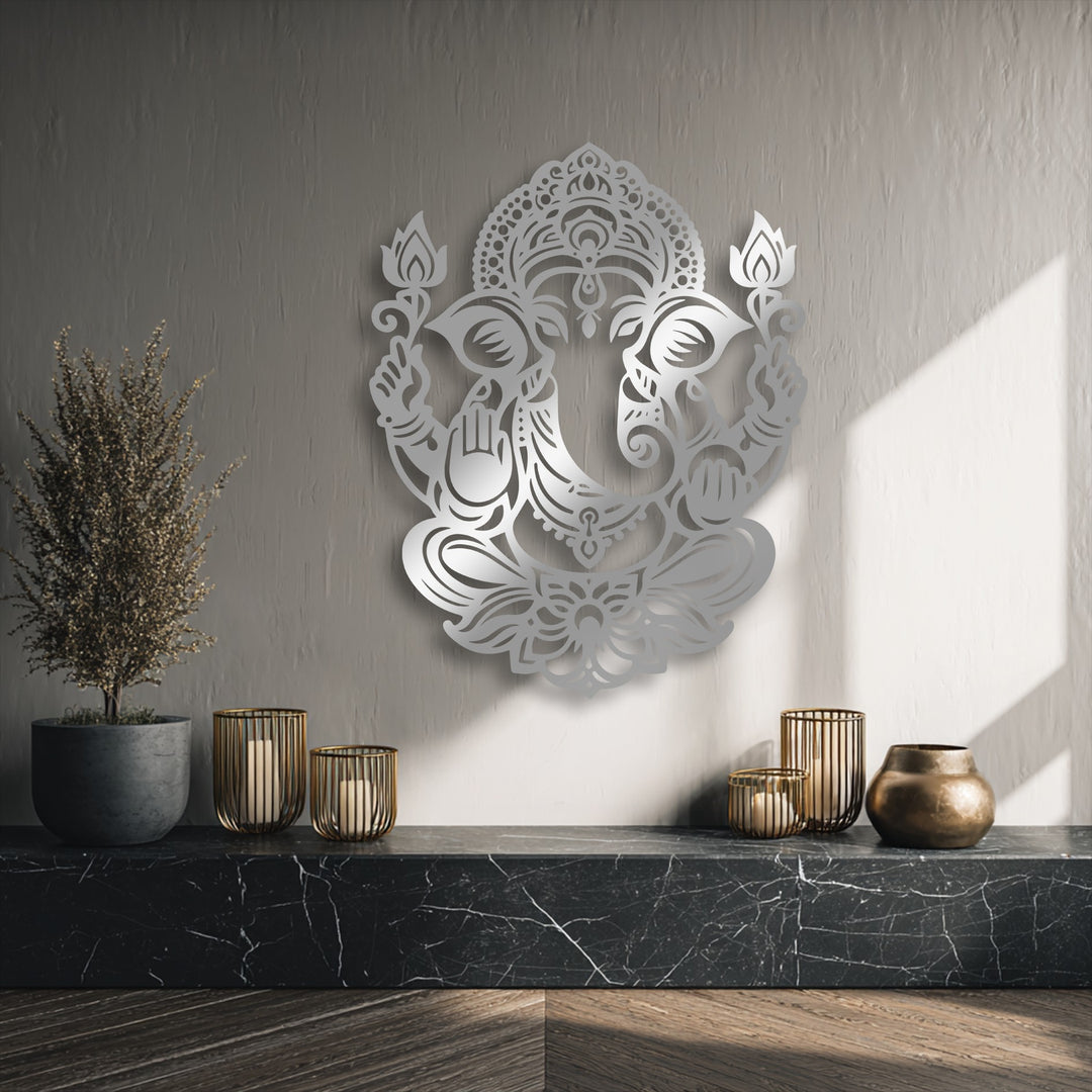The stillness is conveyed by a detailed Ganesha Lotus decorative metal art, gently lit on a wall above a dark marble shelf.