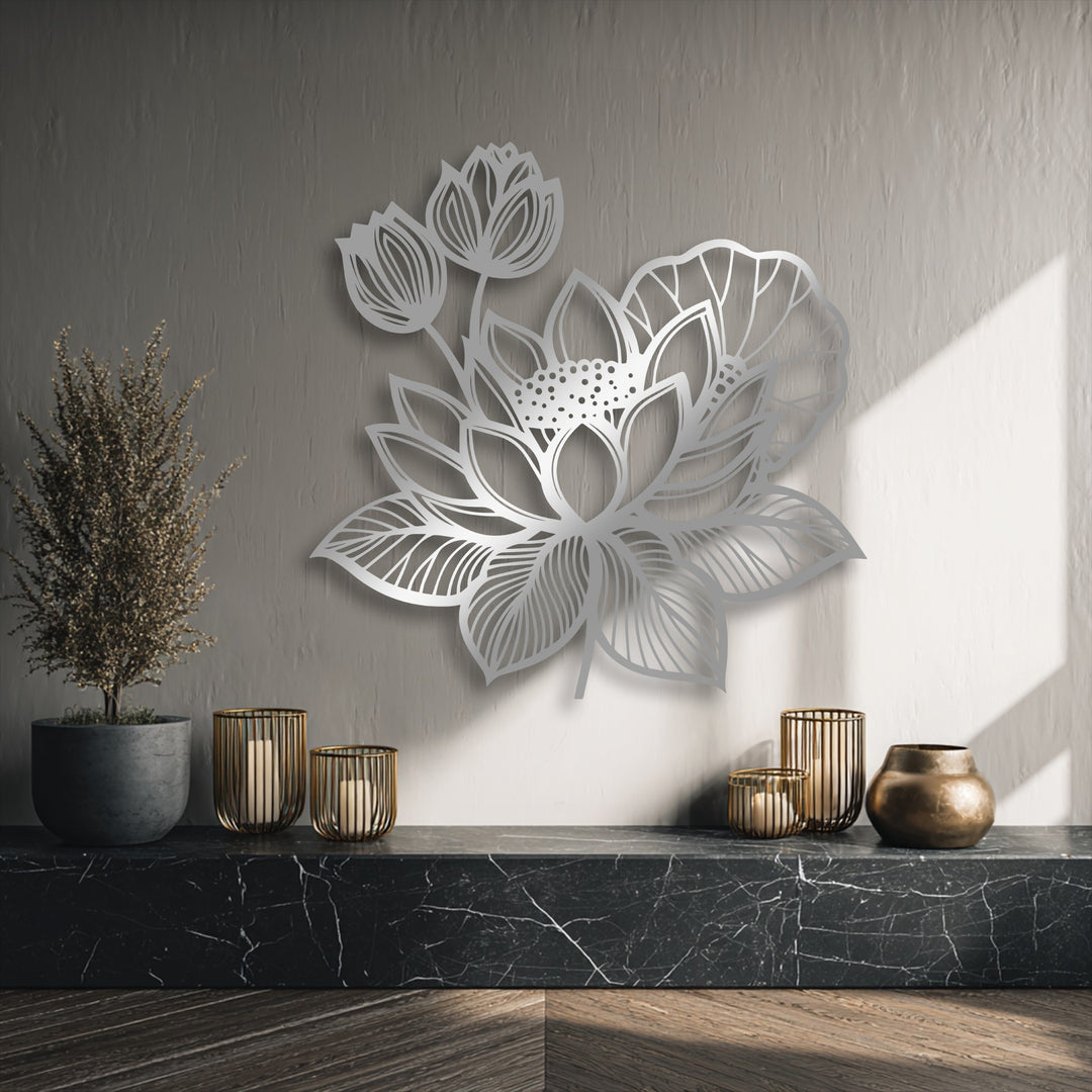 The delicate, organic forms of a lotus floral metal wall decor piece reveal intricate petal and leaf details, enhancing the serene wall.