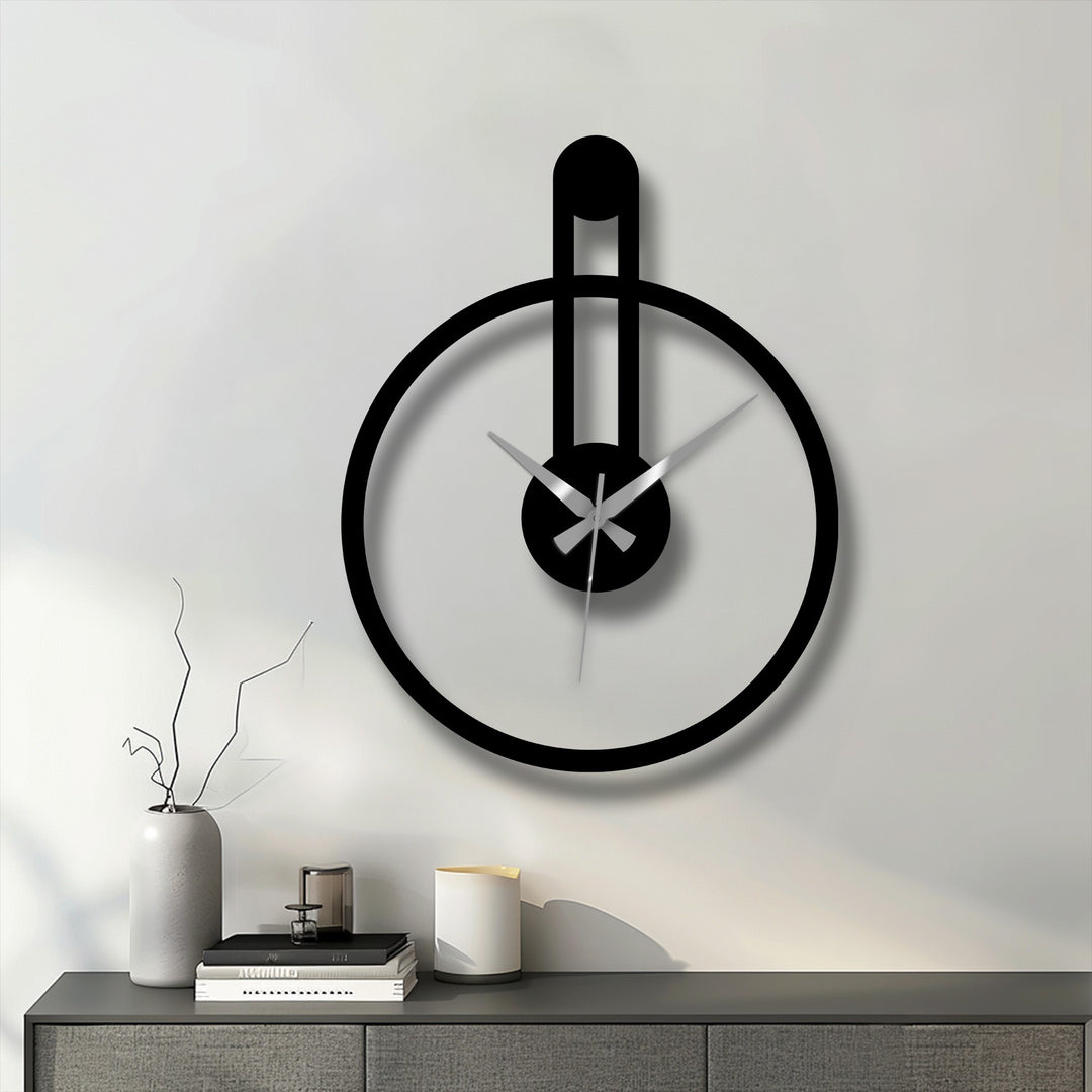 The stillness of the moment captured by this minimalist round metal artwork clock evokes a sense of calm with its modern vertical accent.