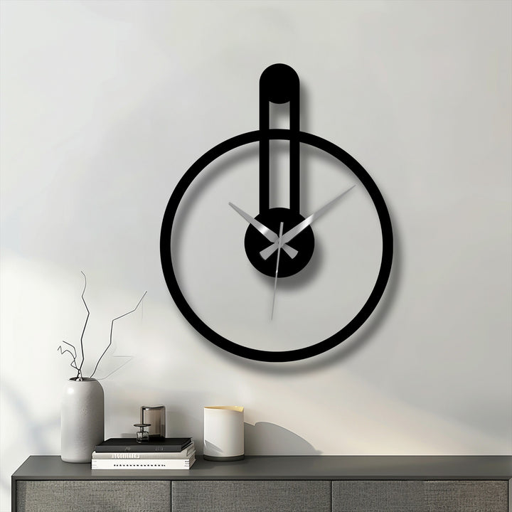 The stillness of the moment captured by this minimalist round metal artwork clock evokes a sense of calm with its modern vertical accent.