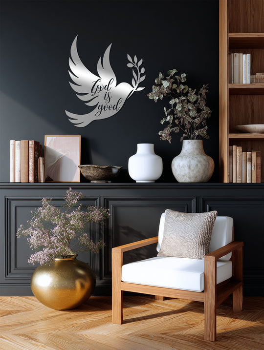 The dove’s reflective surface illuminates this decoration wall art, showcasing the 'God is good' metal piece as a faith-inspired home decor accent.