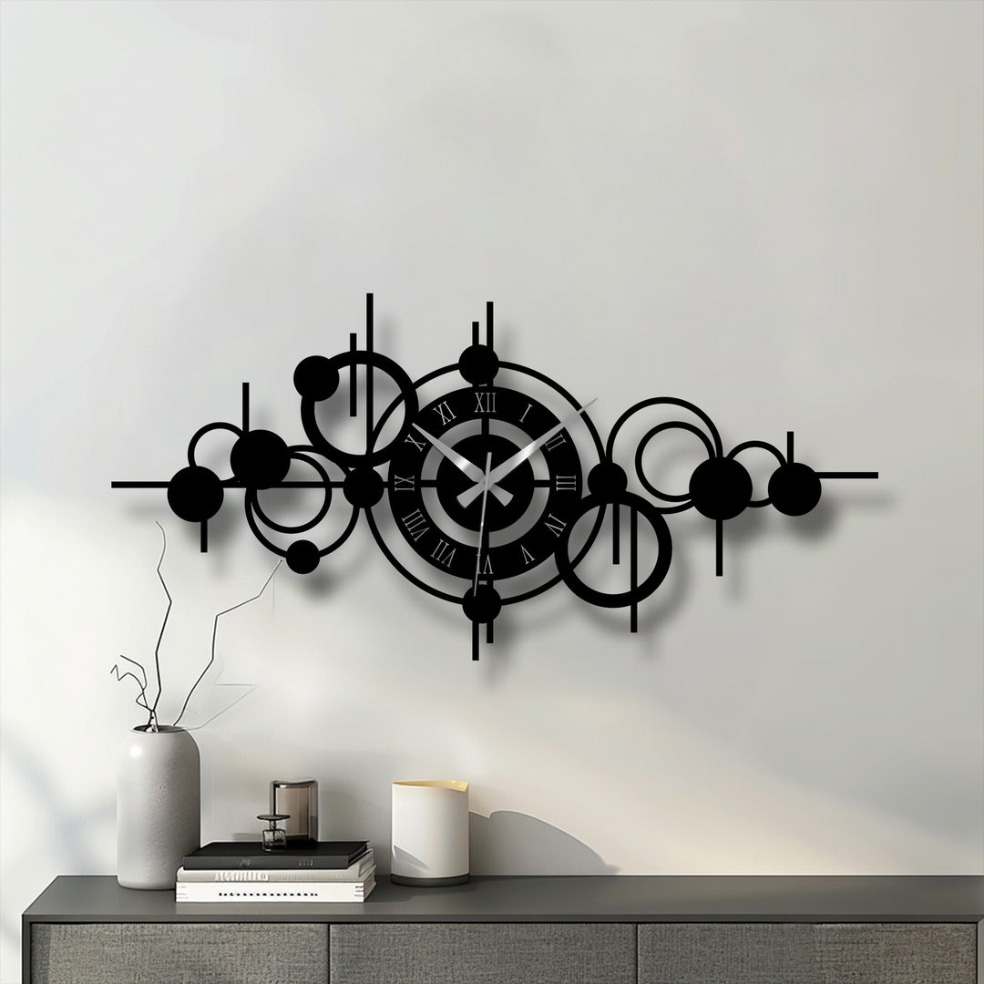 Black dominates this abstract circle orbit metal wall clock, a piece of decorative metal art displaying a modern geometric design.