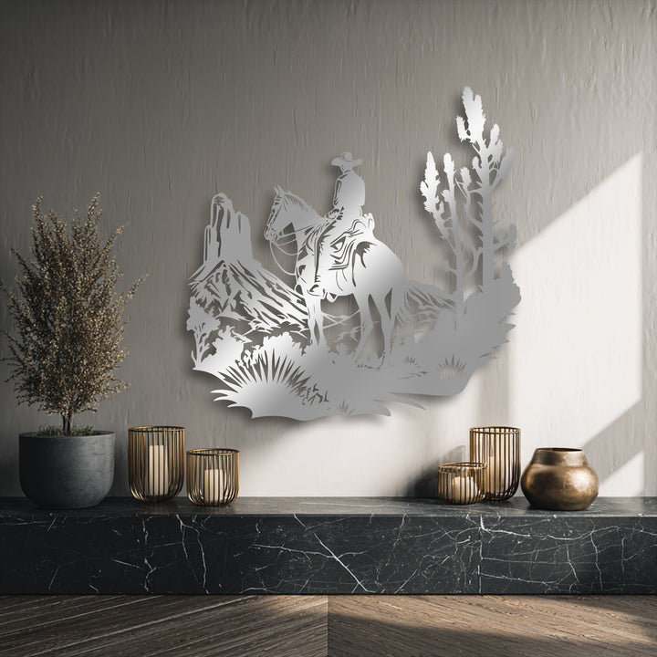 Dark marble shelf with a plant, candles, and bronze vase grounds the Western Cowboy Landscape metal decoration wall art.