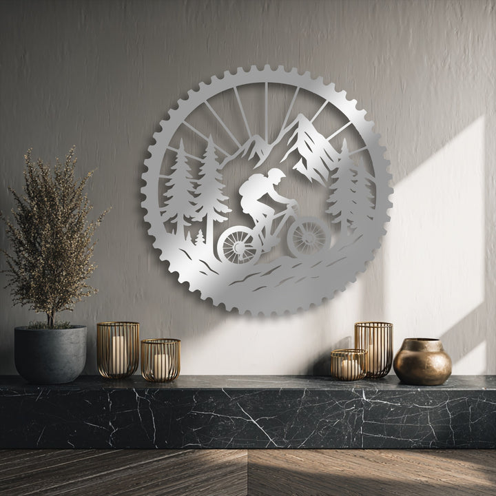 Showcasing impressive depth and layers, this mountain bike adventure metal art for wall features a scenic rider, forest, and mountains.