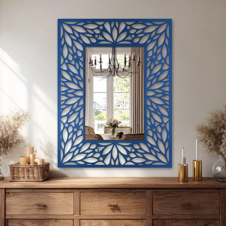 Textured surface of an intricate floral pattern metal wall mirror frame offers a rich feel, adding an element of depth to its metal wall decor.