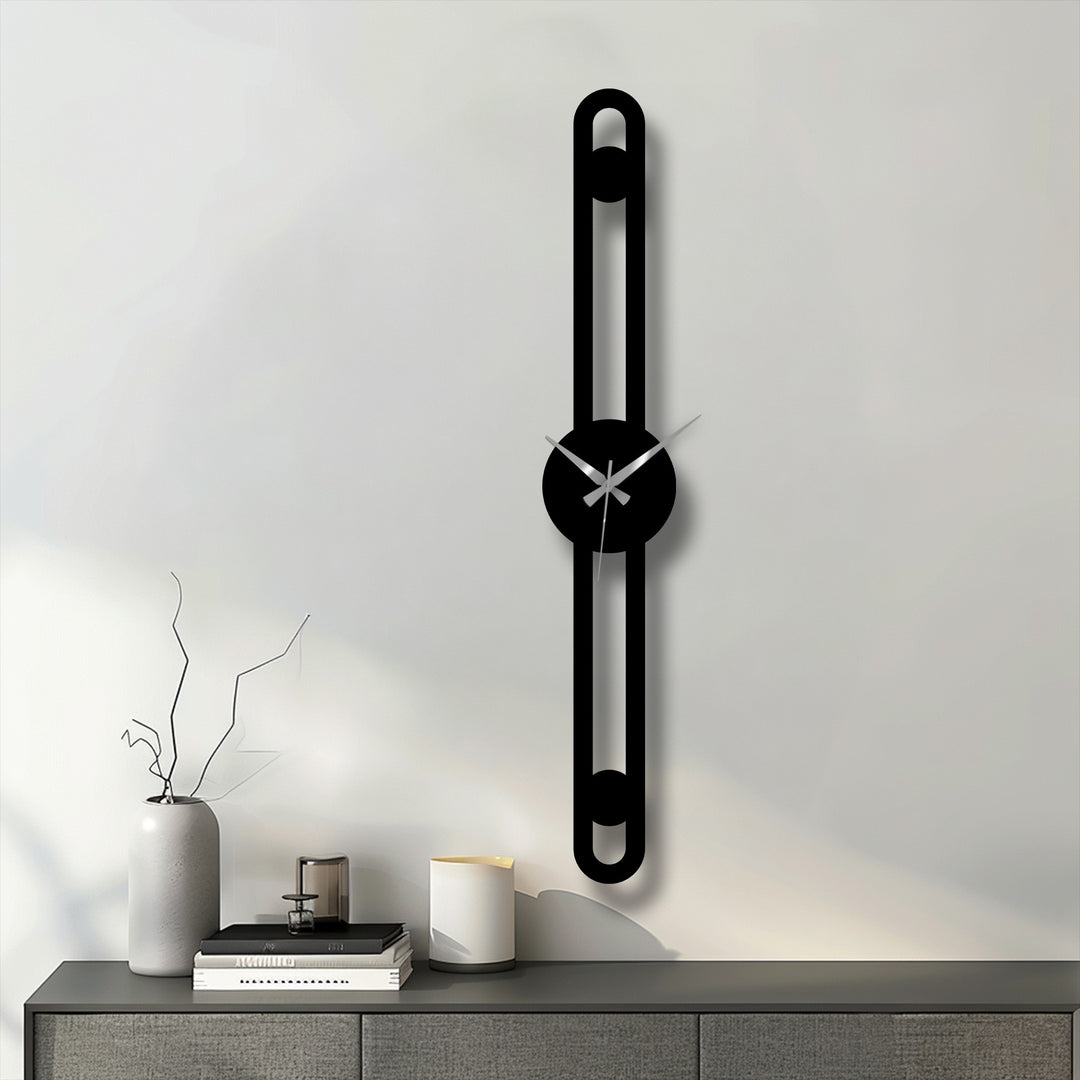 Reduced color saturation highlights the black minimalist vertical metal wall clock, a unique metal wall art piece with a modern, slim line design.