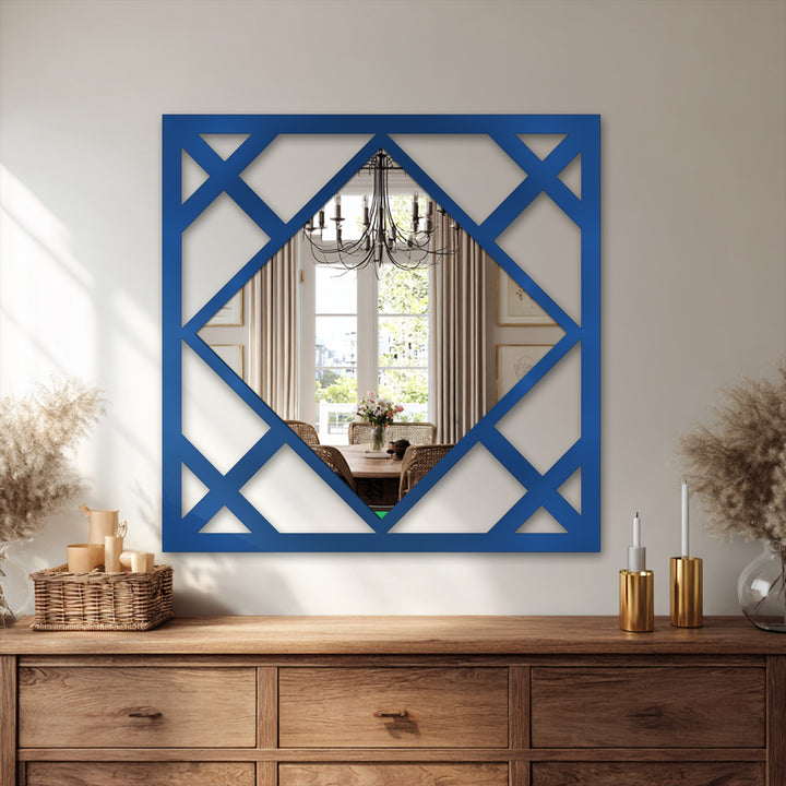 Elegant framed wall mirror boasts a durable, high-quality construction with its precisely cut geometric detailing within the bright blue square frame.