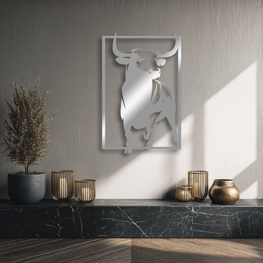 The muted color saturation of the room accentuates the powerful bull unique metal wall art on the textured gray wall.