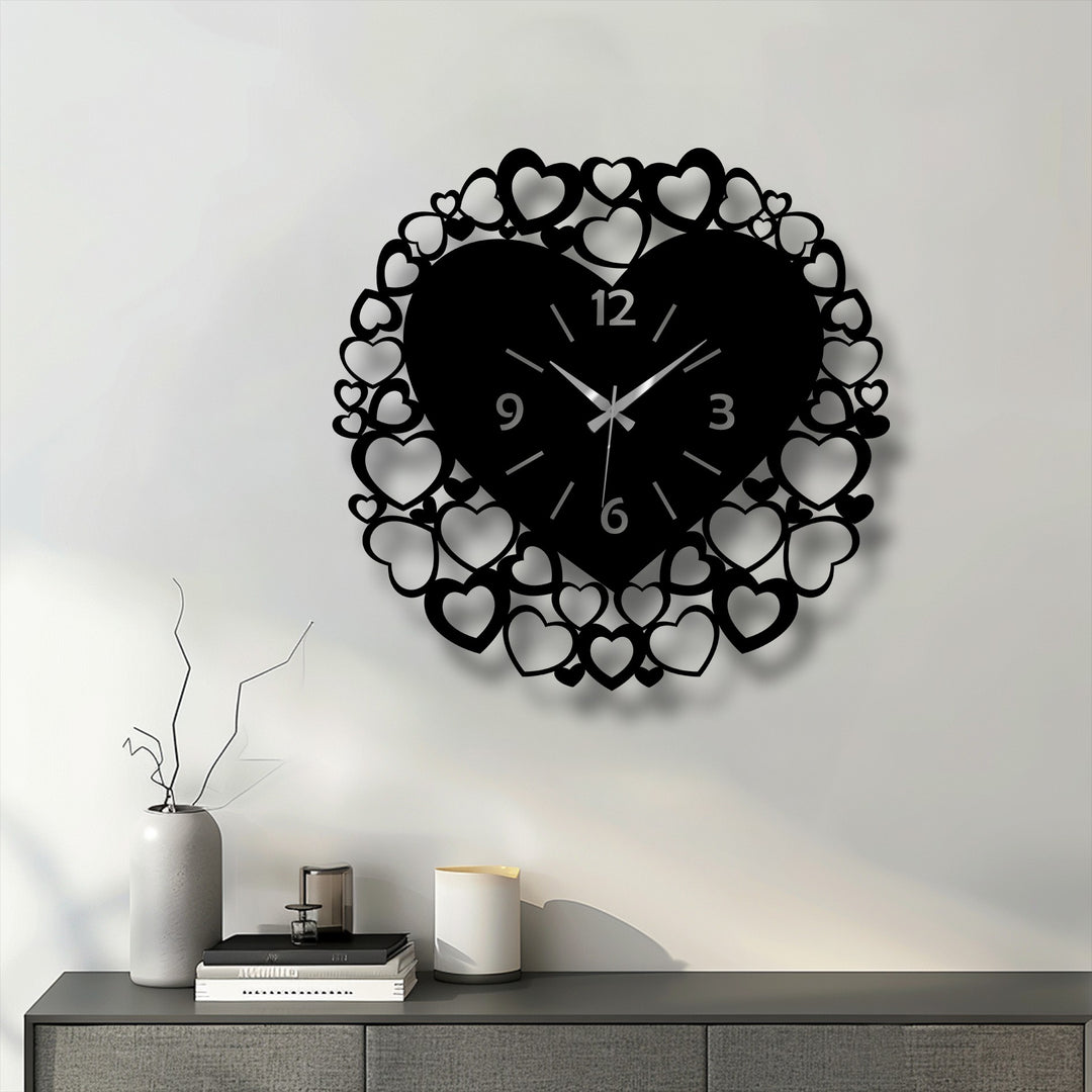 Featuring a striking jet black, this romantic heart frame decorative metal art wall clock showcases an intricate love-inspired design.