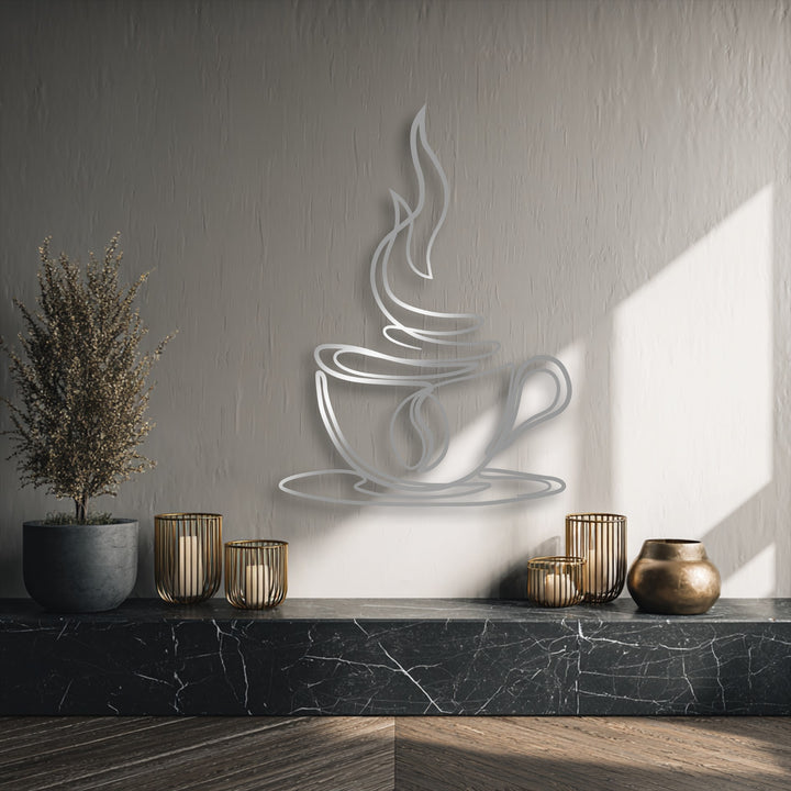 A muted greige wall features a sleek silver coffee cup line art, a unique piece of decoration wall art on a striking black marble surface.