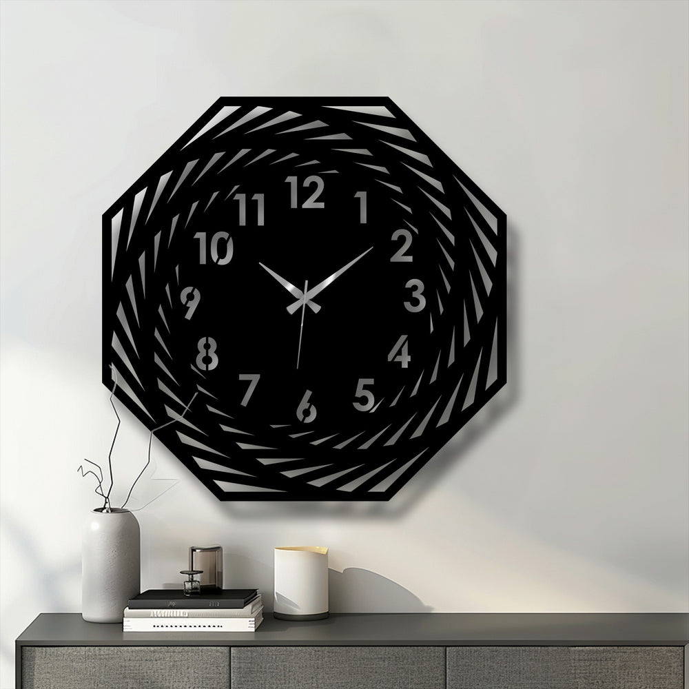 Highlighting the transition between colors, this modern spiral geometric decorative metal art clock showcases its unique spiraling design and clearly marked numbers.