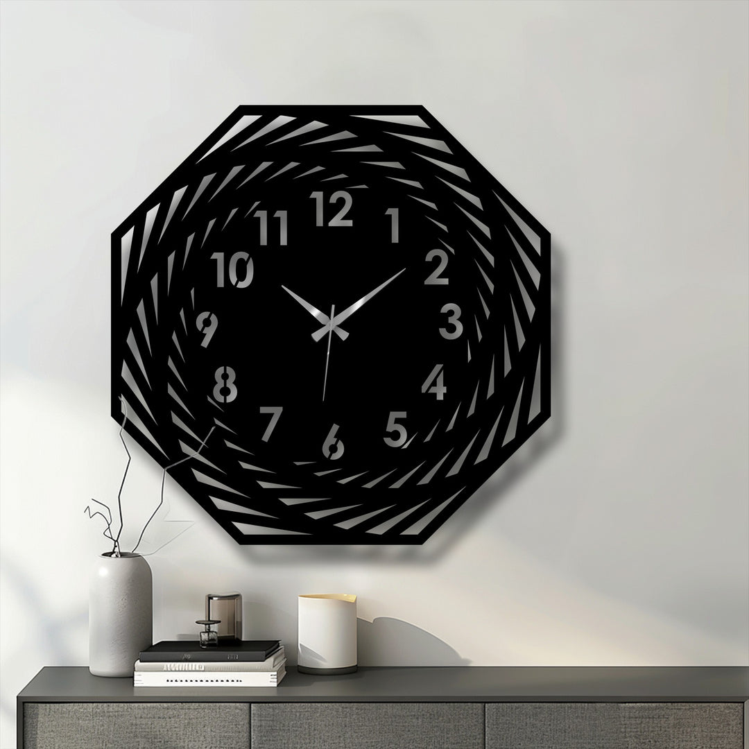 Highlighting the transition between colors, this modern spiral geometric decorative metal art clock showcases its unique spiraling design and clearly marked numbers.