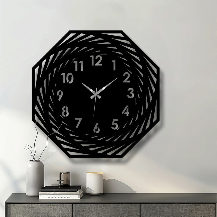 Highlighting the transition between colors, this modern spiral geometric decorative metal art clock showcases its unique spiraling design and clearly marked numbers.