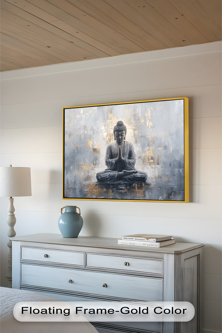 A calming representation of Buddha in a prayerful gesture, radiating tranquility amid a contemporary palette of soft greys and gold.
