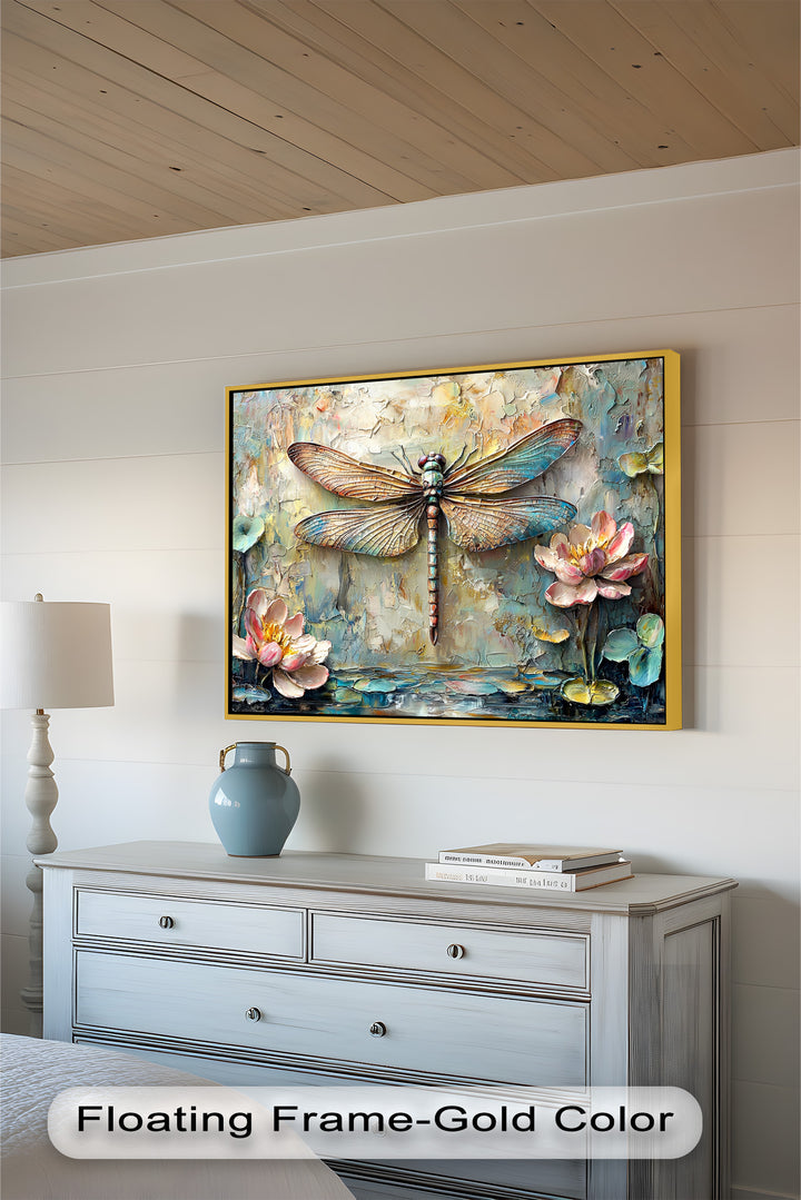 A unique embossed-style artwork featuring a dragonfly in shades of blue, bronze, and gold, complemented by floating water lilies and rustic, weathered textures.