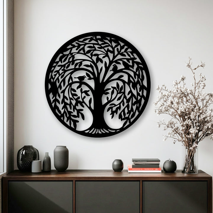 The illuminated white wall vividly showcases the detailed Tree of Life circular silhouette decoration wall art with clear shadows.
