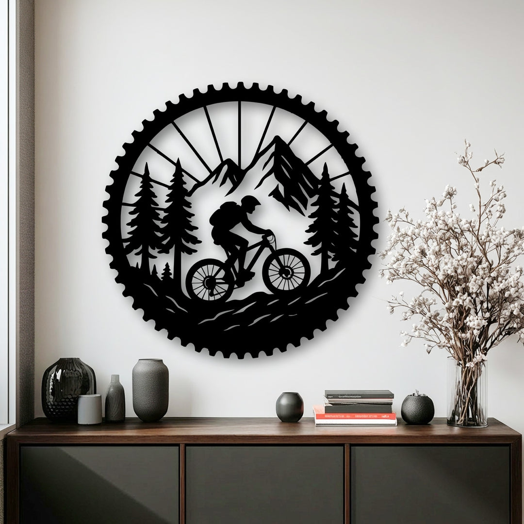Light and shadow enhance the black metal mountain bike adventure decoration wall art, showcasing a rider in a detailed forest and mountain scene.