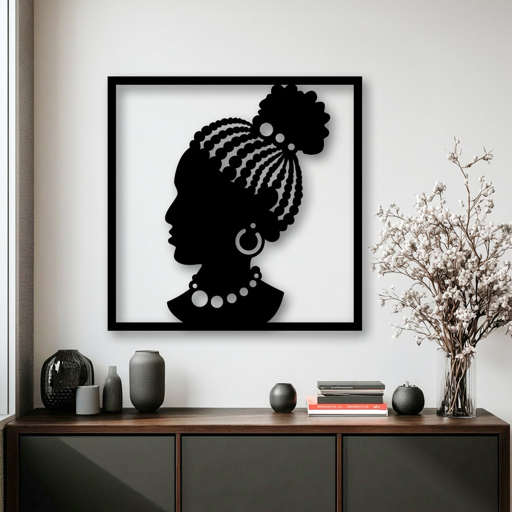 Smooth metal artwork of an elegant African woman silhouette, contrasted by the coarse textures of various decorative vases and dried botanicals.