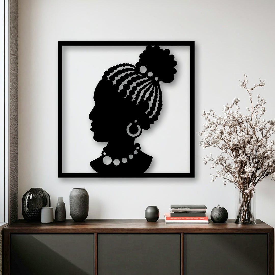 Smooth metal artwork of an elegant African woman silhouette, contrasted by the coarse textures of various decorative vases and dried botanicals.