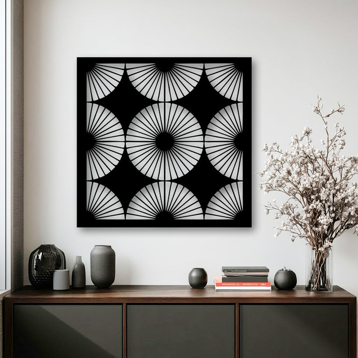 The geometric elements of this unique metal wall art display a radiant fan pattern with striking symmetry, forming a modern abstract design.