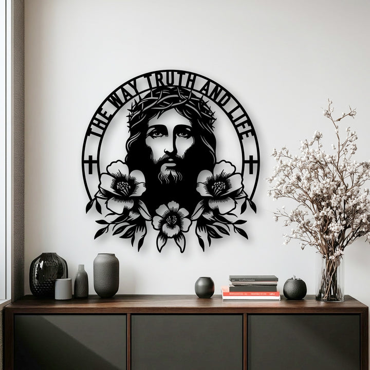 A crisp white wall serves as the background for a large, intricate Sacred Jesus metal wall decor featuring the 'The Way Truth and Life' inscription.