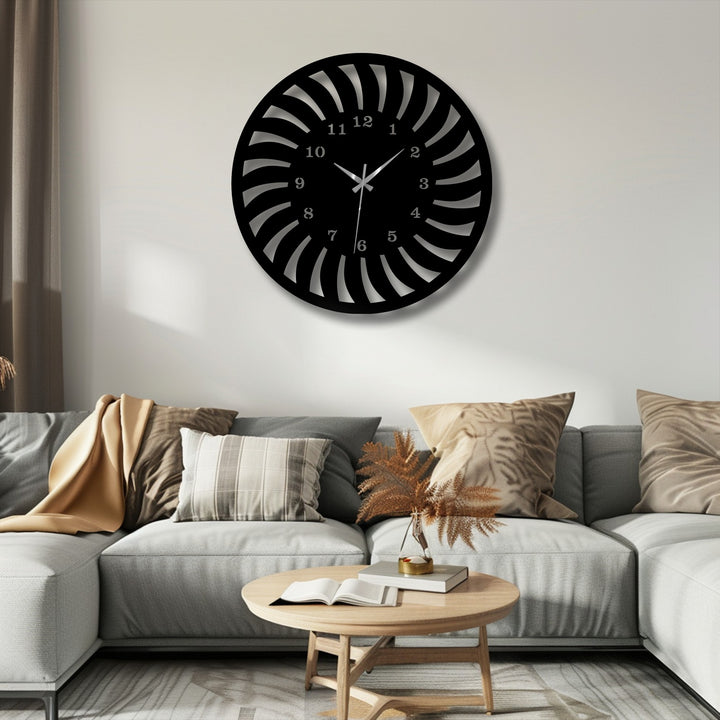 The subtly saturated tones highlight a striking black radial pattern metal wall clock, a unique metal wall art piece with a modern spiral design.