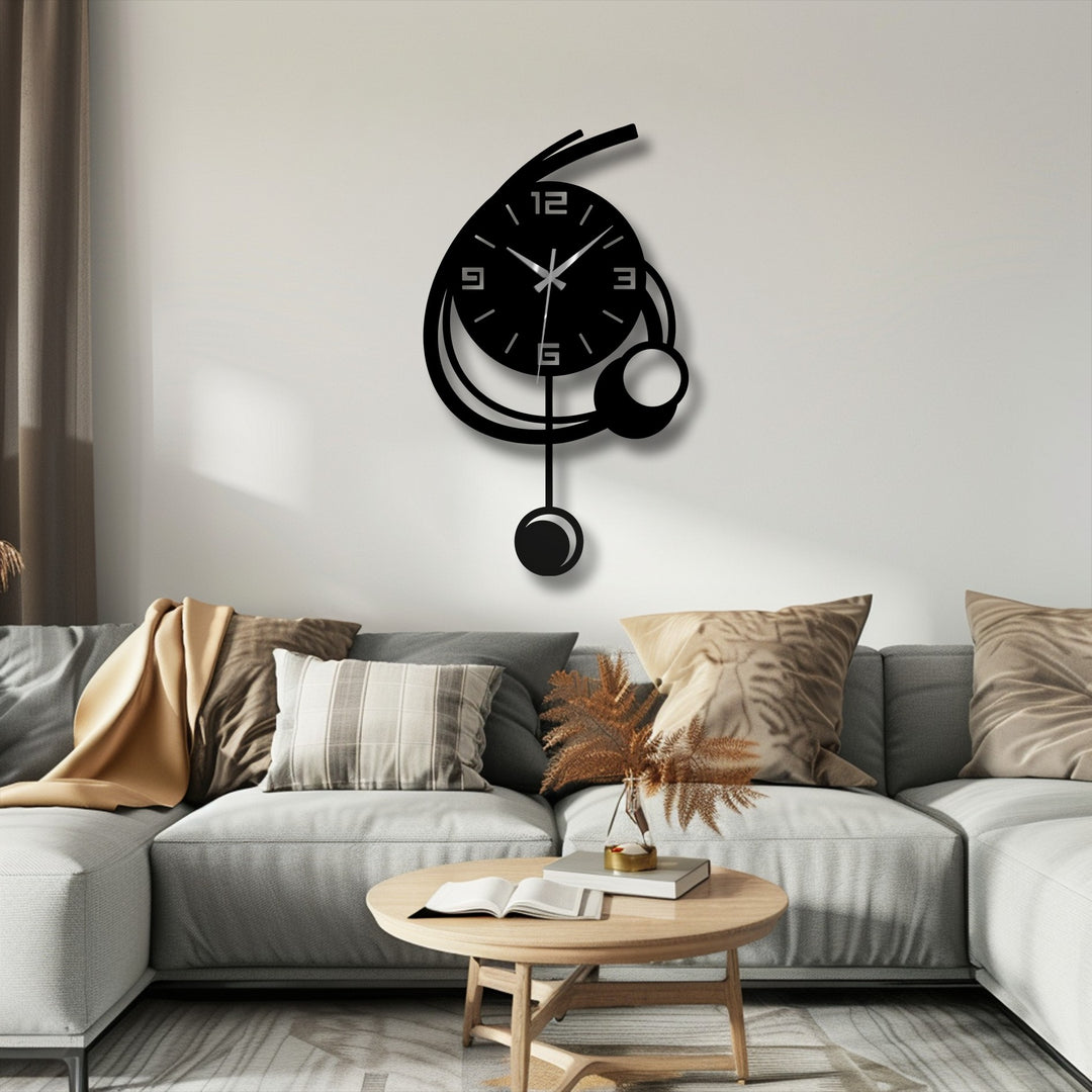 Showcasing the geometric elements of a modern orbit pendant wall clock with a minimalist aesthetic, this metal artwork features interconnected circular and linear forms.