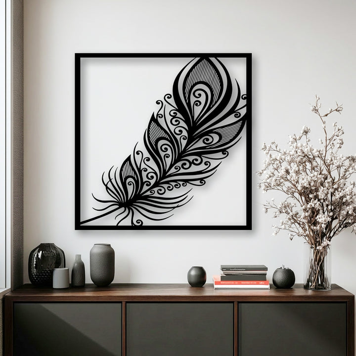 A pristine, minimalist off-white wall provides a serene setting for the elegant ornate feather metal artwork.