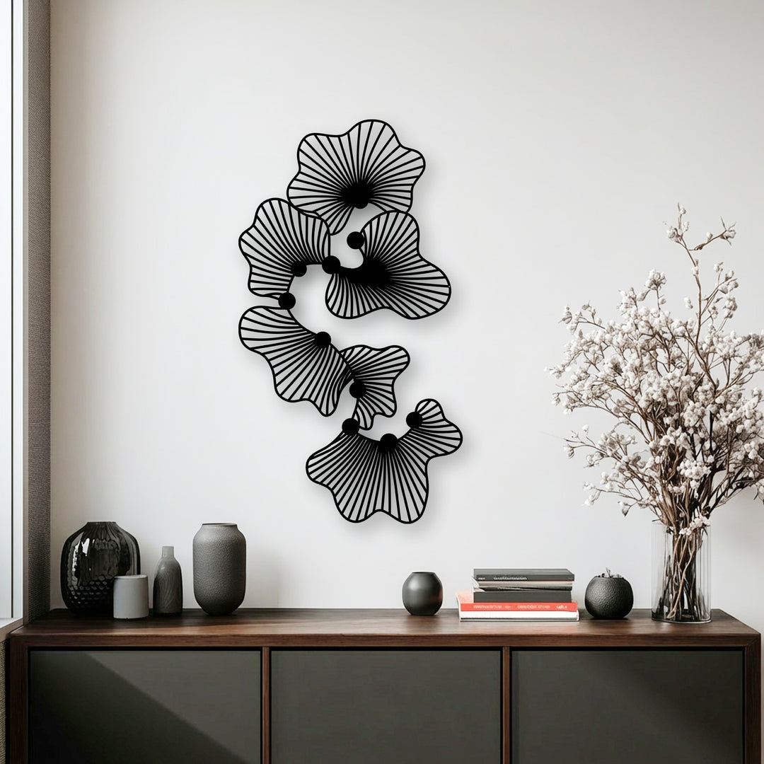 Highlighting the varied surface textures, from the smooth, stylized lines of the unique metal wall art to the subtle grain of the wooden console.