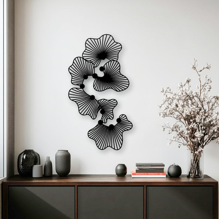 Highlighting the varied surface textures, from the smooth, stylized lines of the unique metal wall art to the subtle grain of the wooden console.