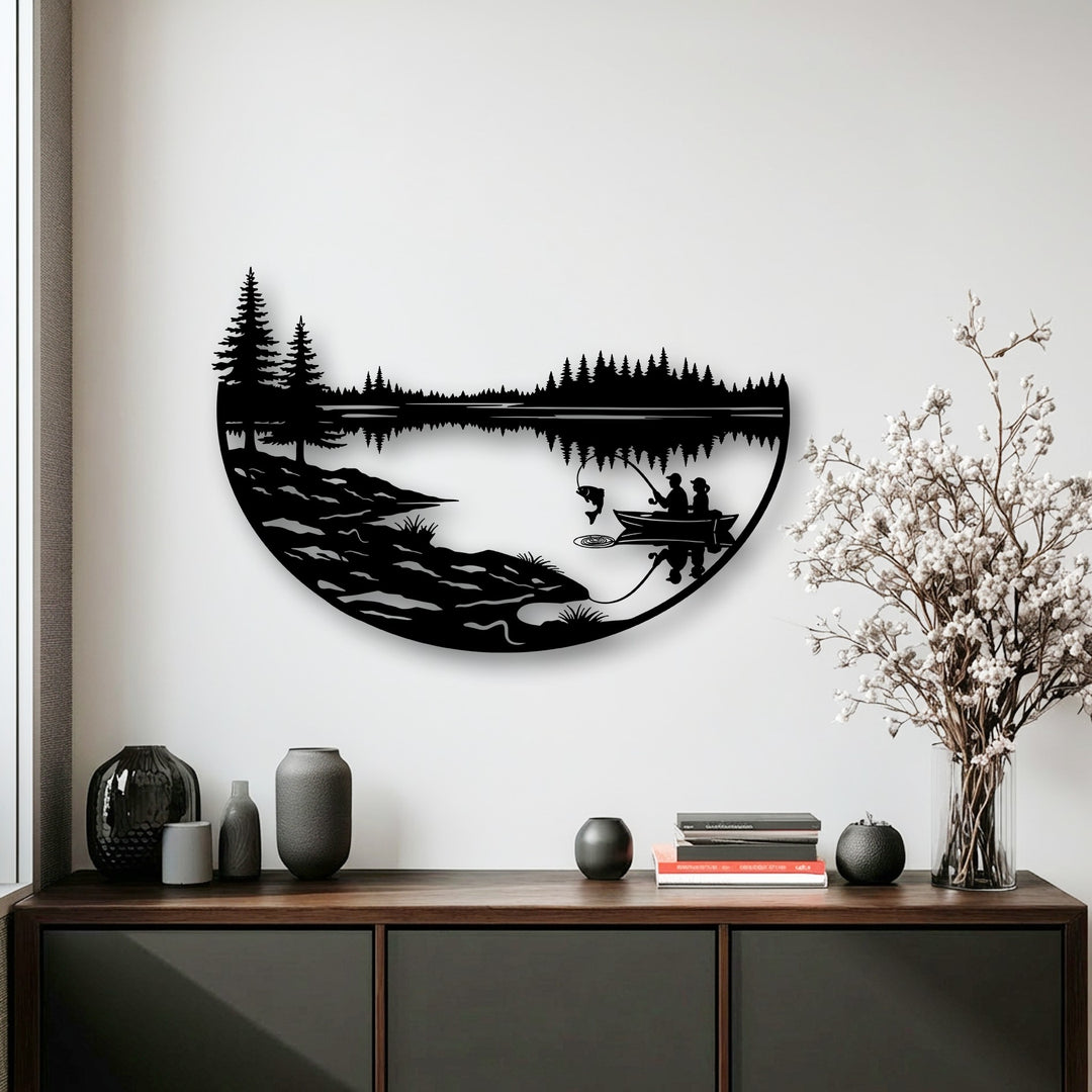 A striking semi-circular metal art for wall displays a tranquil fishing lake scene composed of sharp angular tree silhouettes and smooth horizontal lines.