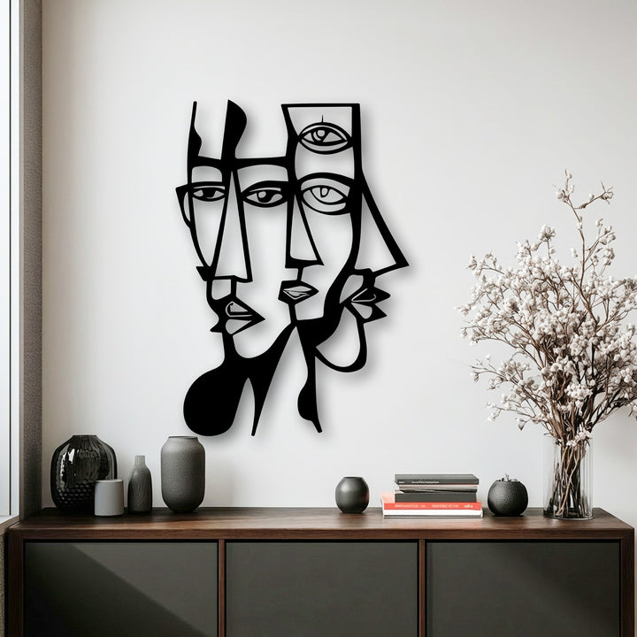 Abstract dual faces and geometric lines create a captivating modern metal decoration wall art piece, blending artistic complexity.