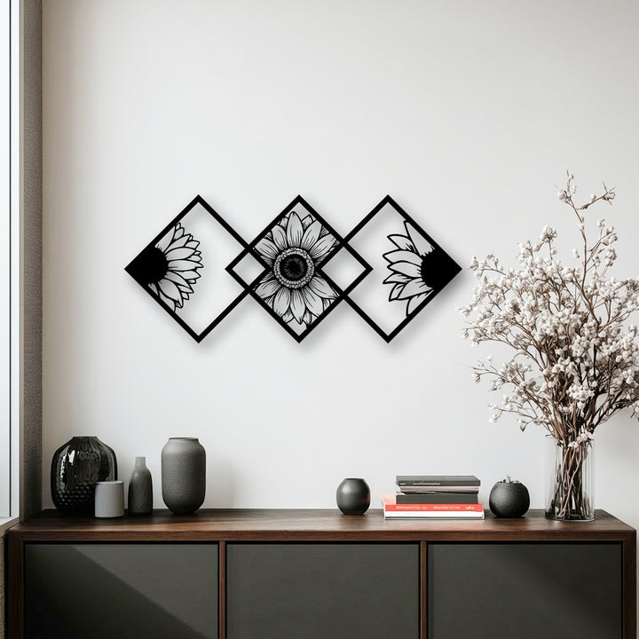 A crisp white wall showcases stunning black geometric sunflower decorative metal art, forming a modern floral panel display.