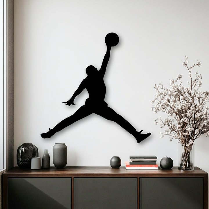 The unique metal wall art of a basketball player features crisp, defined edges with a subtle shadow border, enhancing its floating design.