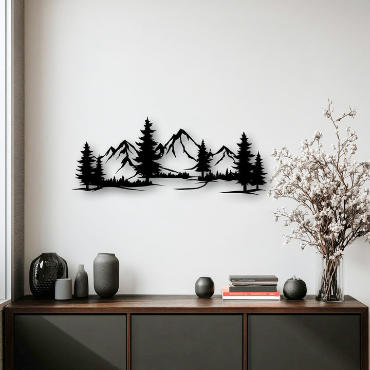 The sharp, angular geometric elements of this mountain forest landscape metal wall decor create a striking panoramic silhouette.