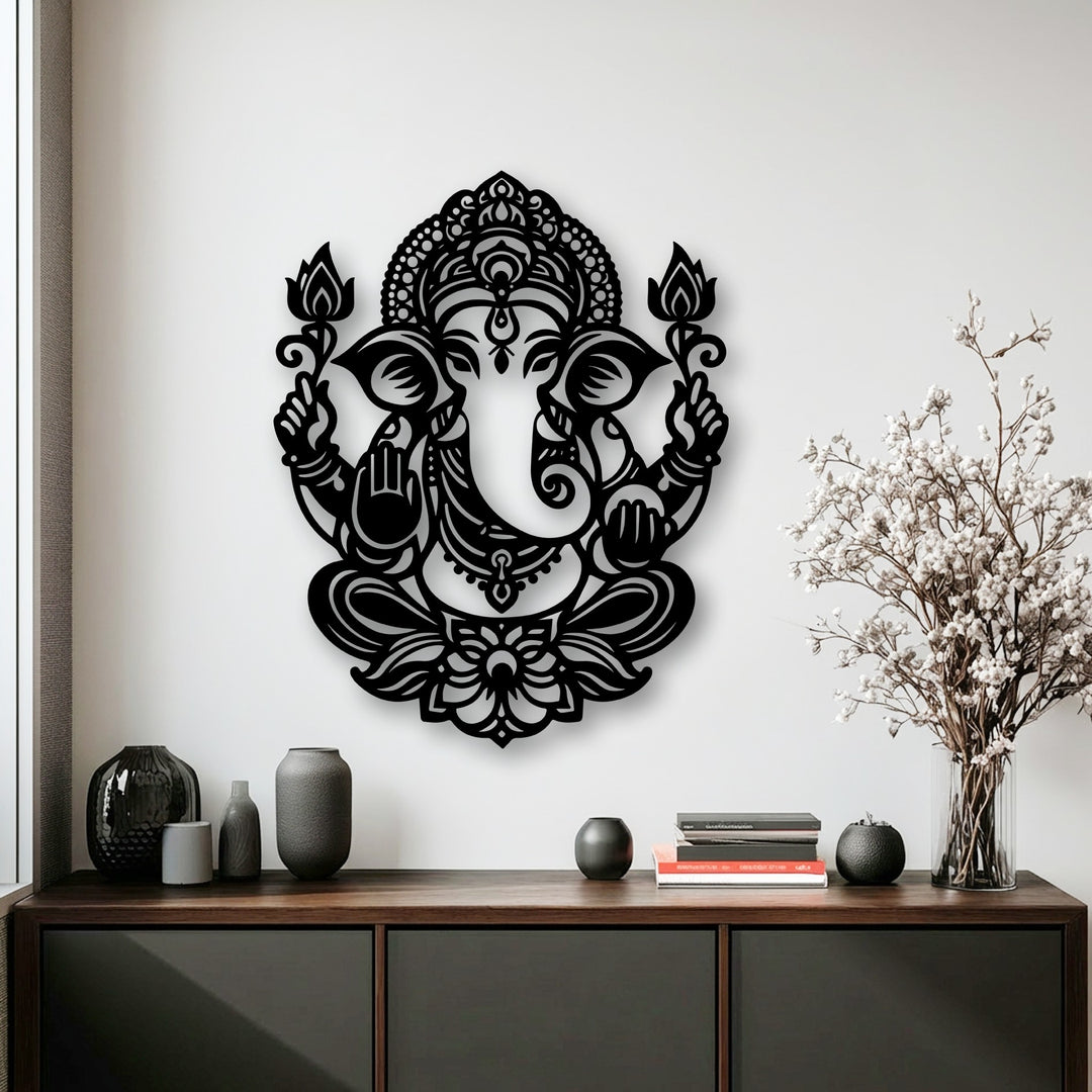 The intricate black Sacred Ganesha Lotus metal wall decor stands as the prominent focal point against a bright white wall.