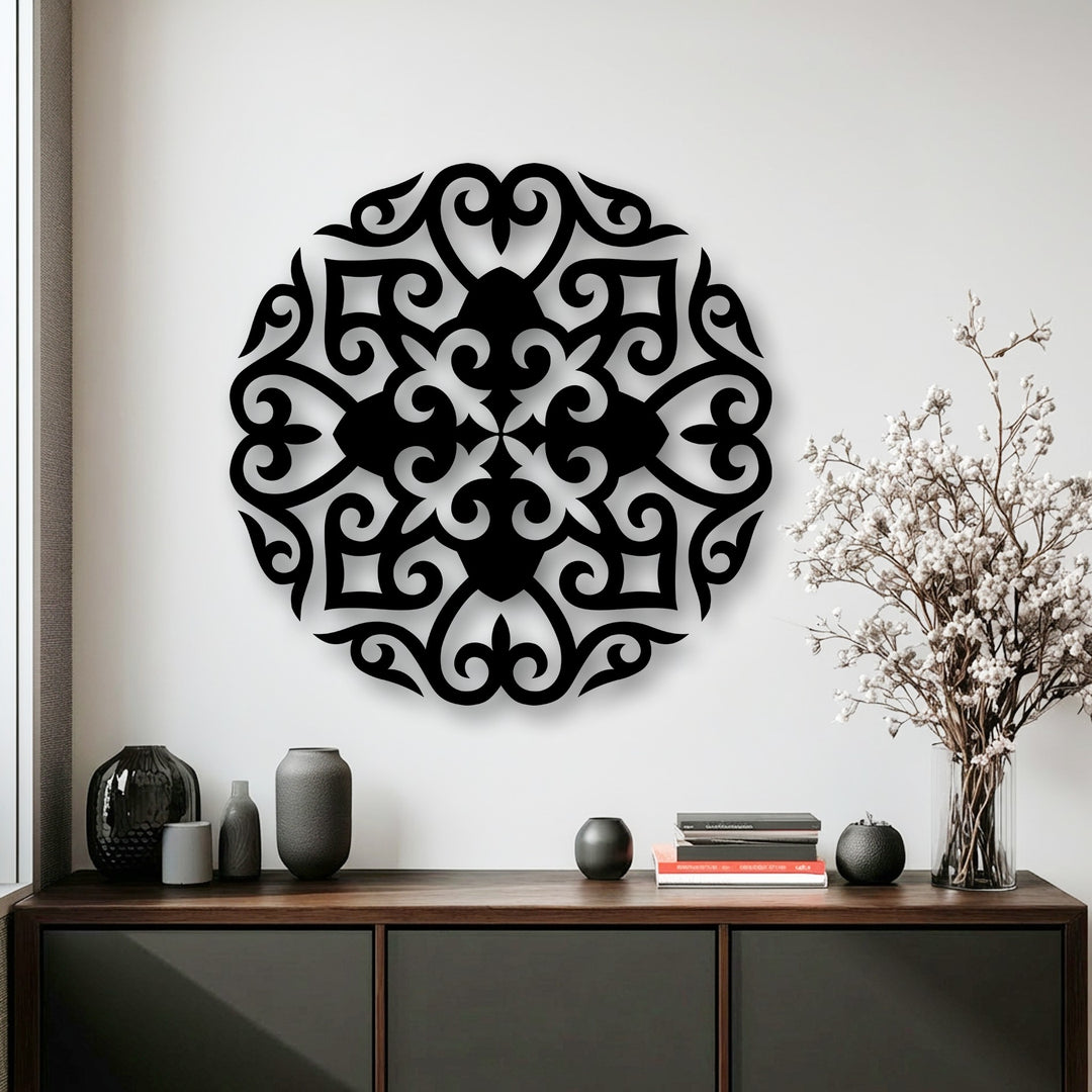 The pristine white wall background elegantly showcases the intricate floral mandala metal decoration wall art, casting subtle shadows.