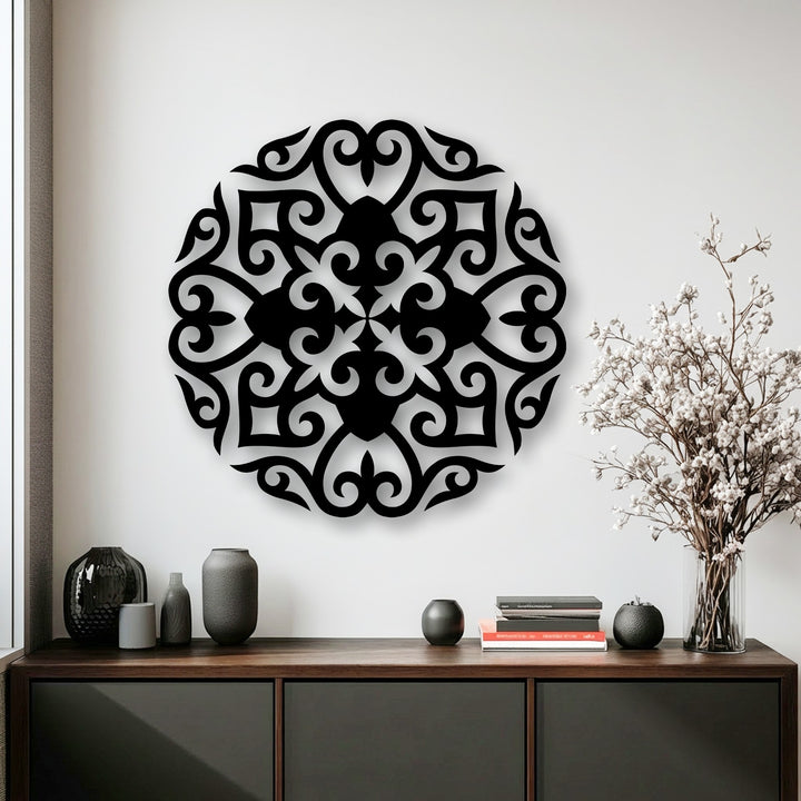 The pristine white wall background elegantly showcases the intricate floral mandala metal decoration wall art, casting subtle shadows.