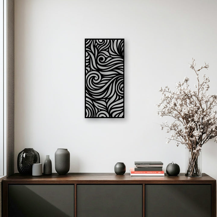 Through its intricate cut-out design, this unique metal wall art creates striking depth and layers with flowing patterns against a lighter surface.