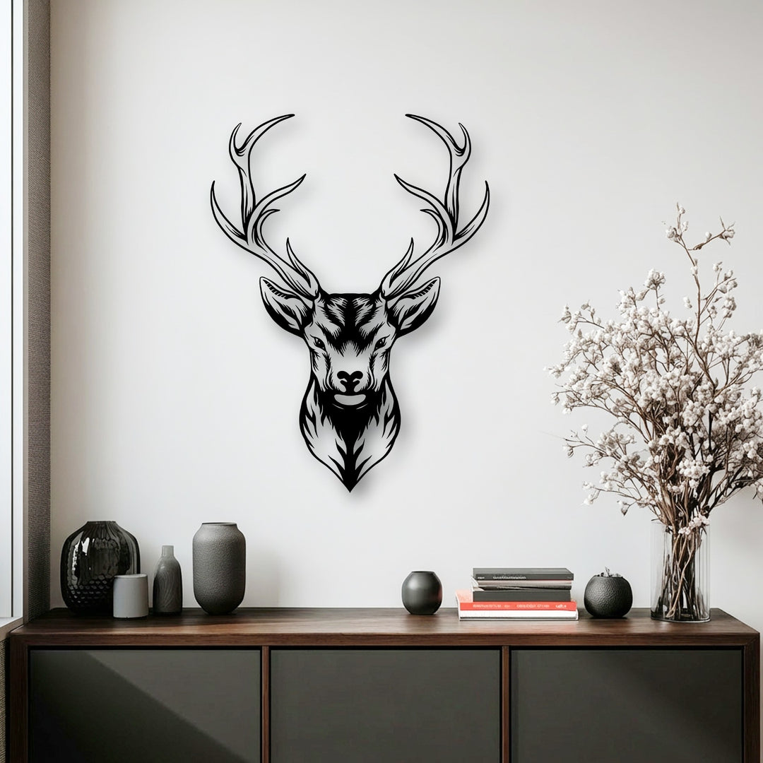 A sophisticated and serene mood is evoked by this unique metal wall art showcasing a majestic deer head with an antler design.