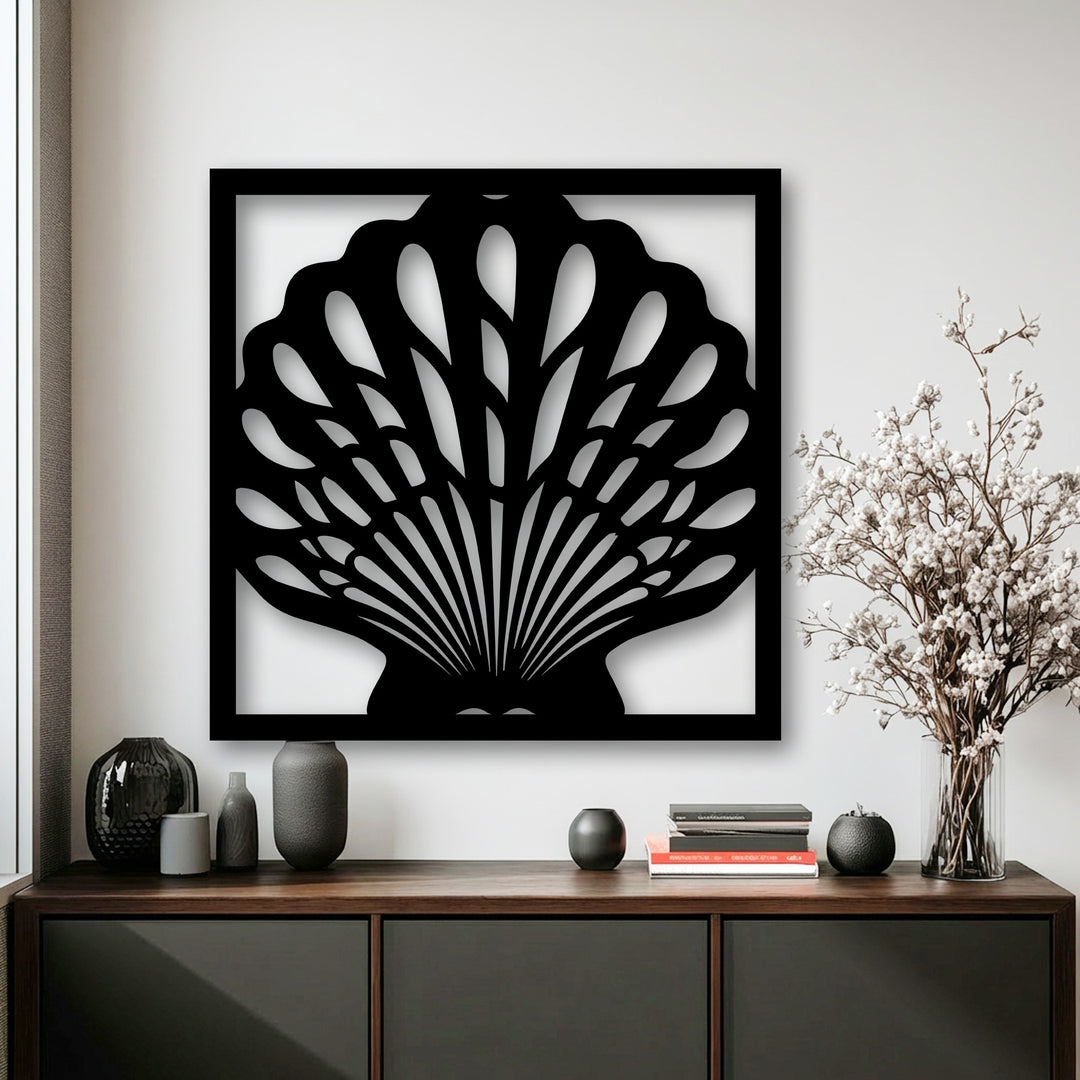 Smooth, dark decorative metal art displaying an Ocean Elegance seashell frame with sleek surface texture.