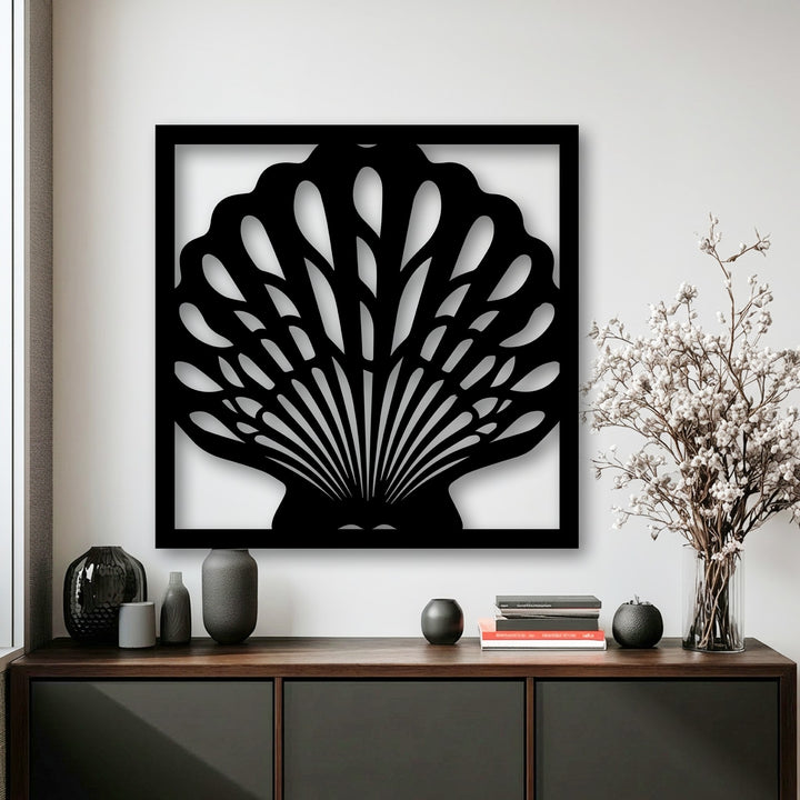Smooth, dark decorative metal art displaying an Ocean Elegance seashell frame with sleek surface texture.