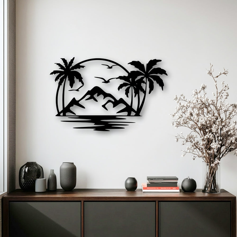 A matte black finish defines this metal artwork, showcasing a striking tropical island scene with palm trees, mountains, and an ocean.