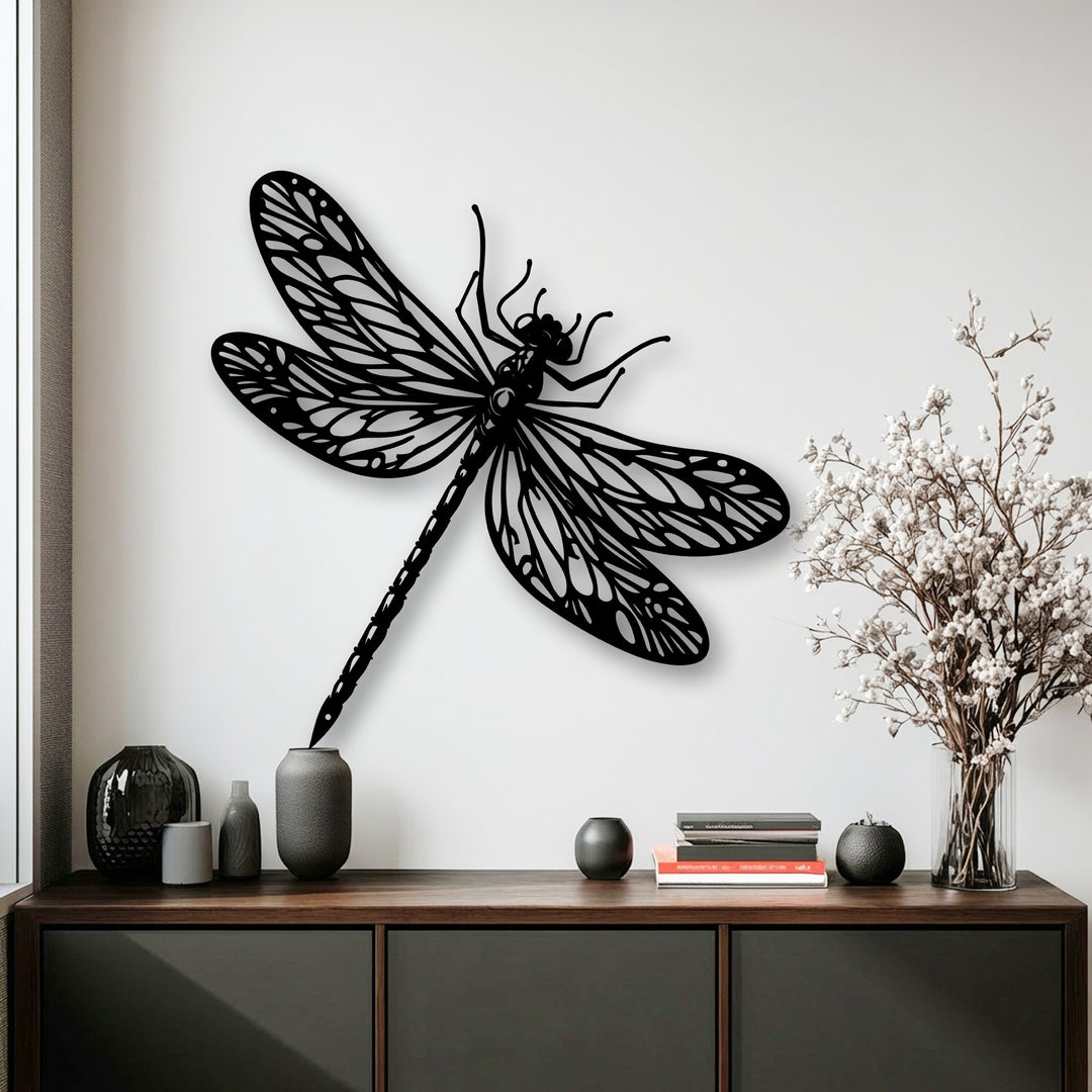 The intricate, organic silhouette of a black dragonfly metal art for wall with detailed wings creates a striking nature-inspired display.