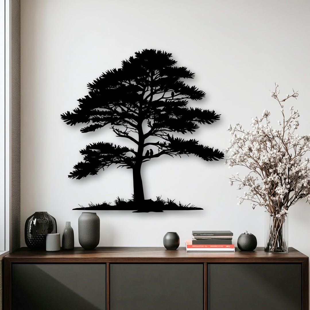 The abstract silhouette of a whispering pine tree provides elegant metal wall decor, casting a subtle shadow that enhances its minimalist artistry.